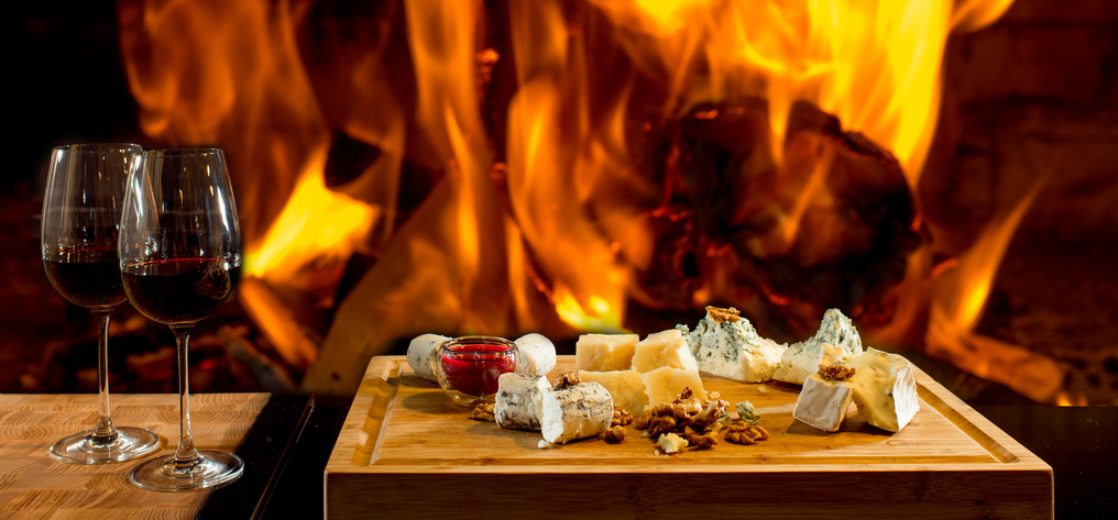 delicious cheese and wine at the fireplace